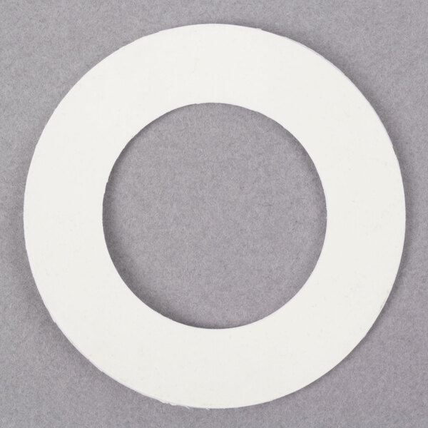 A white rubber washer with a hole in the center.
