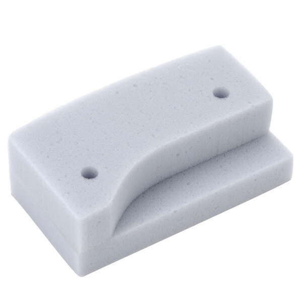 A white foam baffle with two holes.