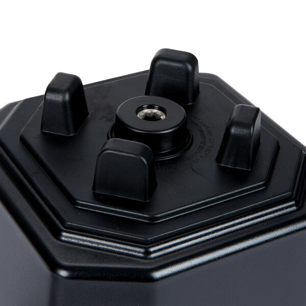 A black square Waring jar pad with four knobs.
