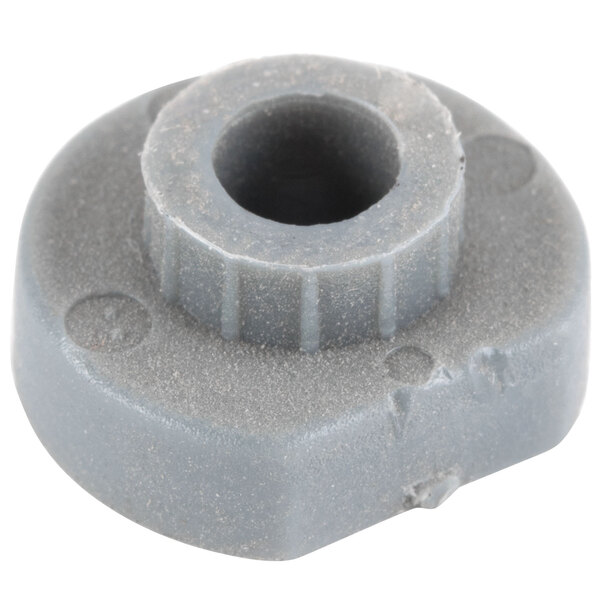 A grey plastic Waring motor screw plug with a hole in it.