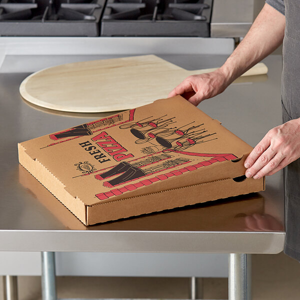 A person opening a Choice kraft corrugated pizza box.