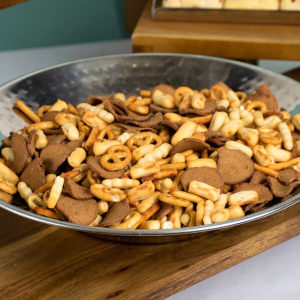 A bowl of Deluxe Snak-ens Mix on a table.