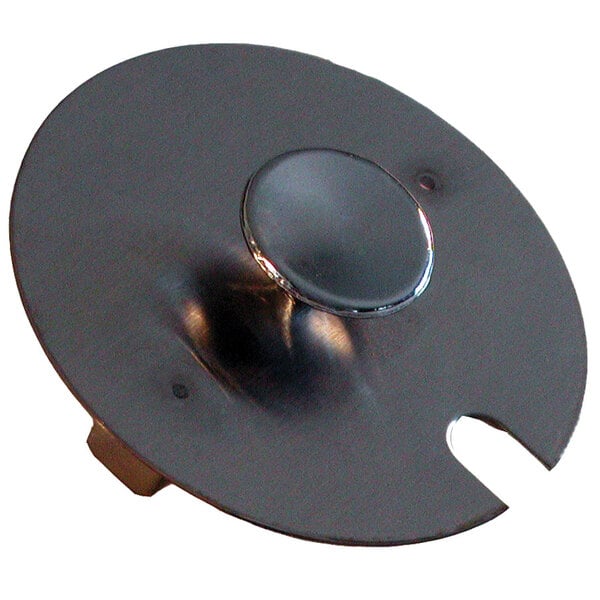 A silver circular metal lid with a hole in it.