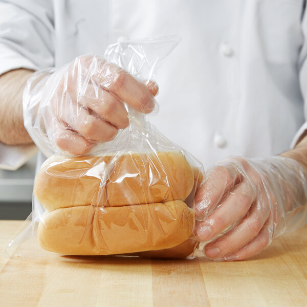A person holding a LK Packaging plastic bag of food