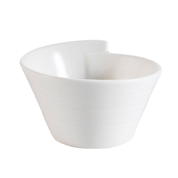 A CAC New Bone White porcelain small bowl with a curved design.