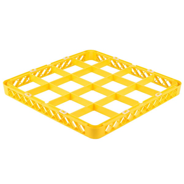 A yellow plastic tray with white squares and holes.