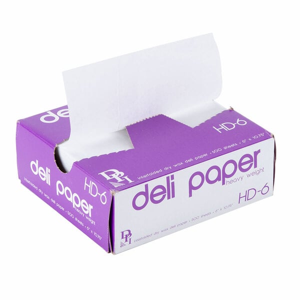 A purple box of white Durable Packaging deli sheets with white text.