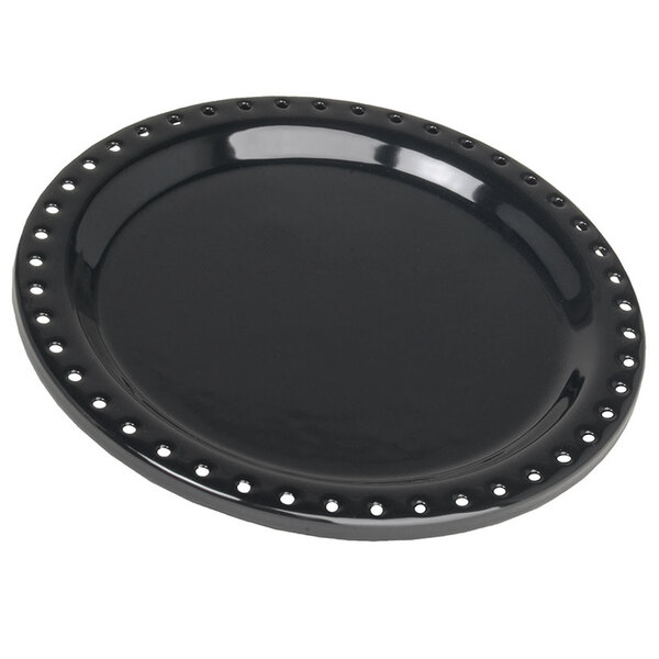 A black Bunn warmer dish with holes.