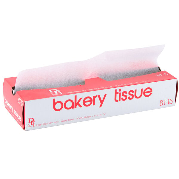 A white and red Durable Packaging box with bakery tissue paper inside.