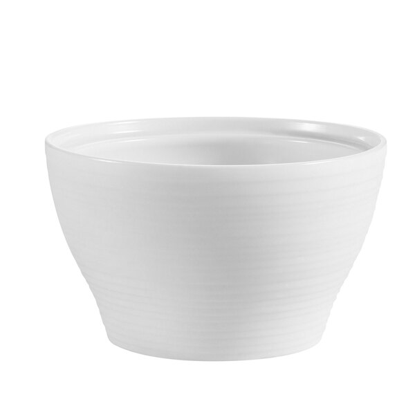 A CAC bright white porcelain bouillon bowl with a curved edge on a white background.