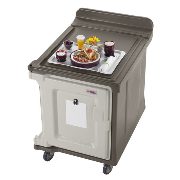 A tray of food on a Cambro low profile meal delivery cart.
