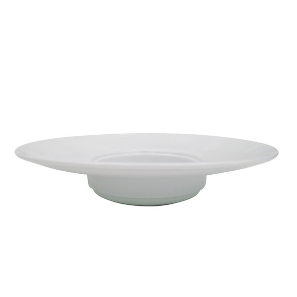 A close up of a CAC Harmony white porcelain pasta bowl with a wide rim.