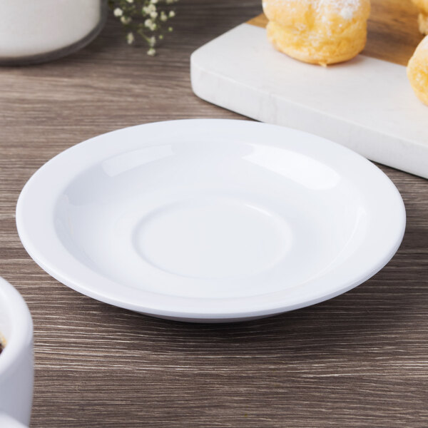 A white GET Diamond White saucer on a table.