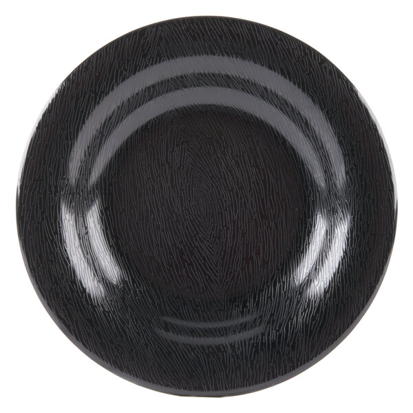 A close-up of a textured black GET Etchedware bowl.