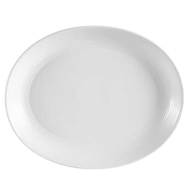 A bright white porcelain oval platter with a curved edge.