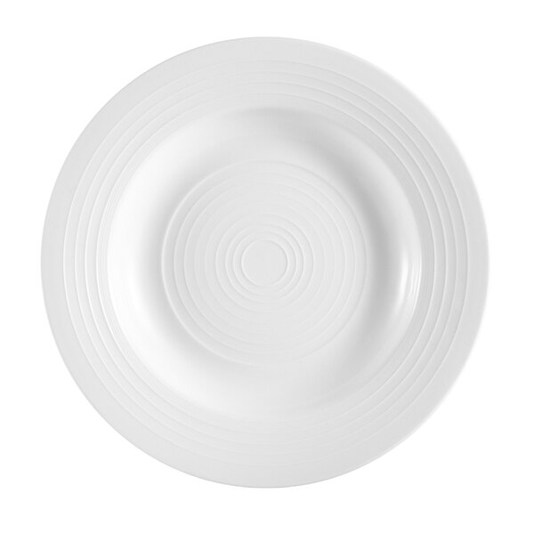 A white pasta bowl with a circular pattern of spirals.