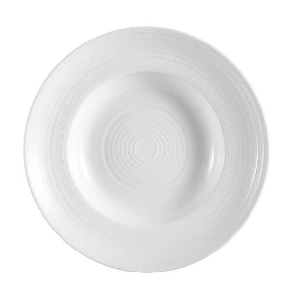 A white porcelain pasta bowl with a spiral pattern in the center.