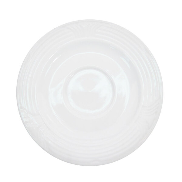 A CAC porcelain saucer with a circular embossed design.