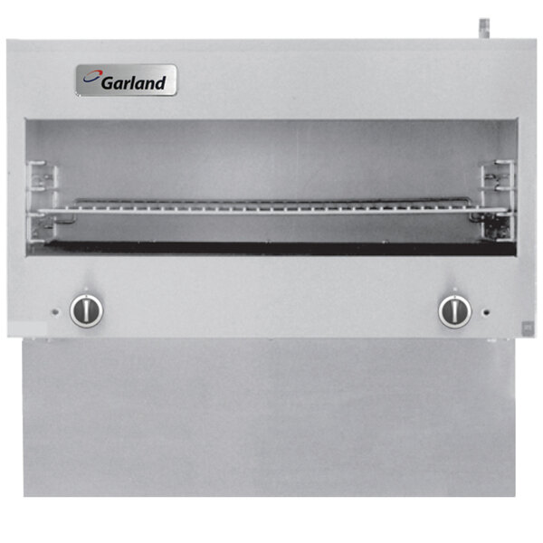 A stainless steel Garland cheese melter grill with two burners.