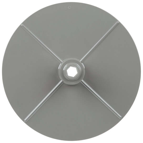 A gray circular disc with a hole in the center.
