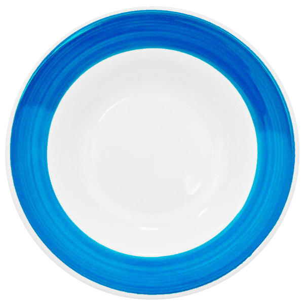 A blue and white CAC pasta bowl with a rim.