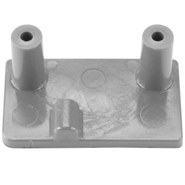 A gray plastic bracket with two holes.