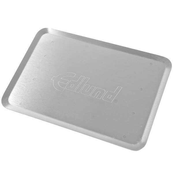 A silver tray with the word Edlund on it.
