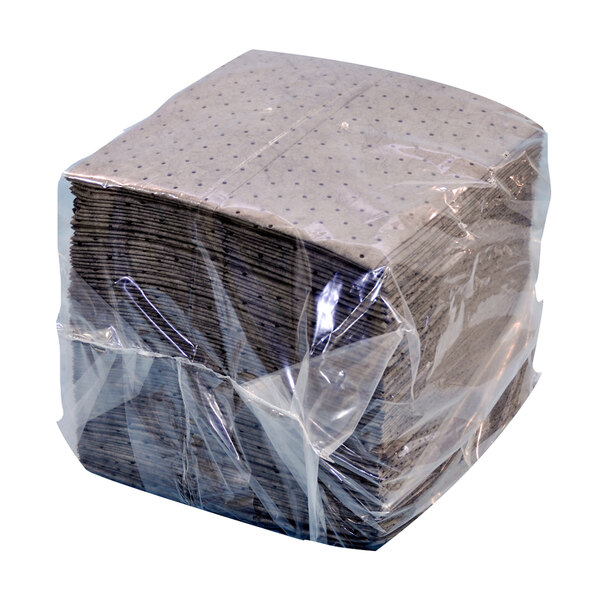 A large stack of gray Spilfyter absorbent pads in a plastic bag.