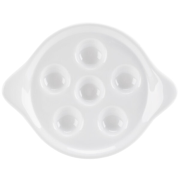 A bright white porcelain plate with six round holes.