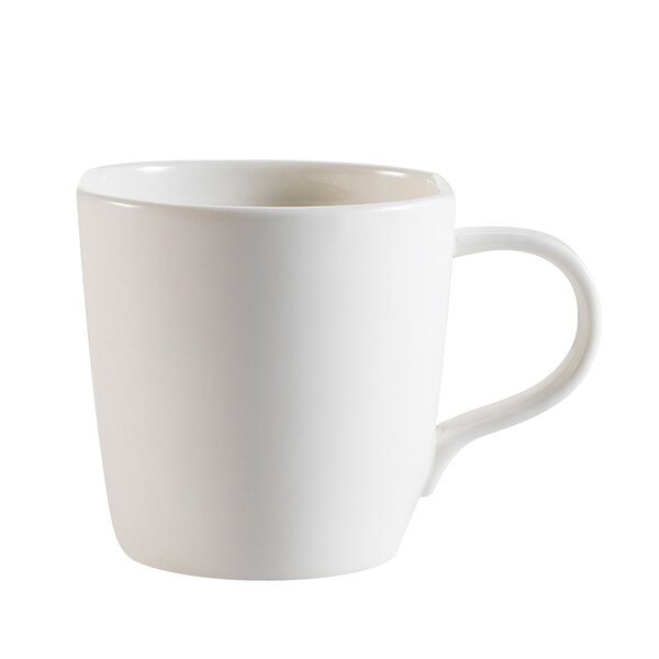 A close-up of a CAC bone white porcelain mug with a handle.