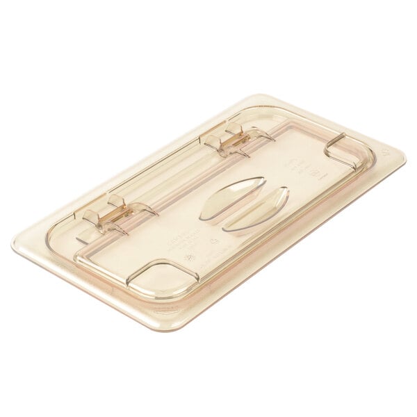 A clear plastic tray with a Cambro H-Pan amber FlipLid.