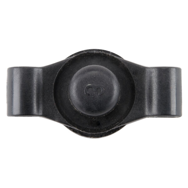 A close-up of a black plastic Waring grinding wheel end cap.