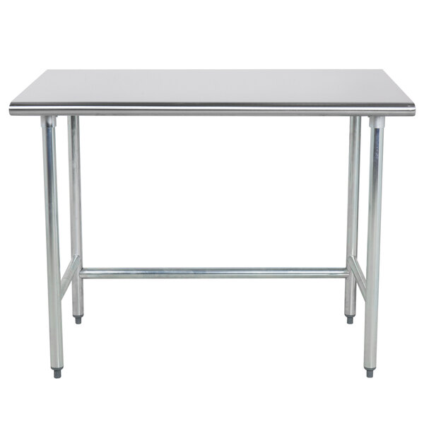 A Advance Tabco stainless steel work table with metal legs.