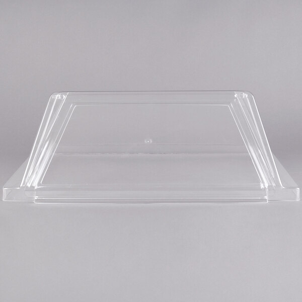 A clear plastic sneeze guard with a lid for an Avantco hot dog roller grill.