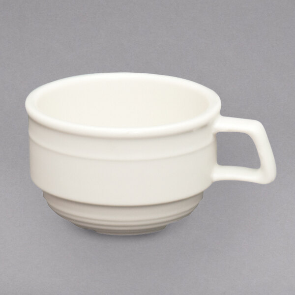 A white Homer Laughlin stackable china cup with a handle.