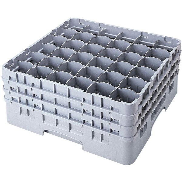 A white plastic Cambro glass rack with 36 compartments.