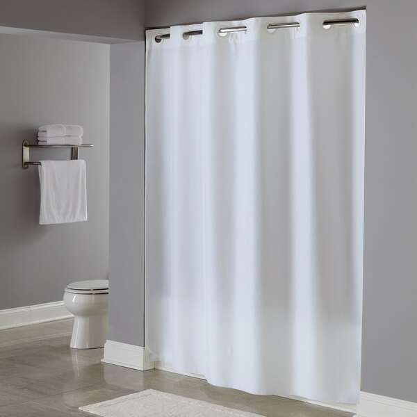 A white Hookless shower curtain in a bathroom.