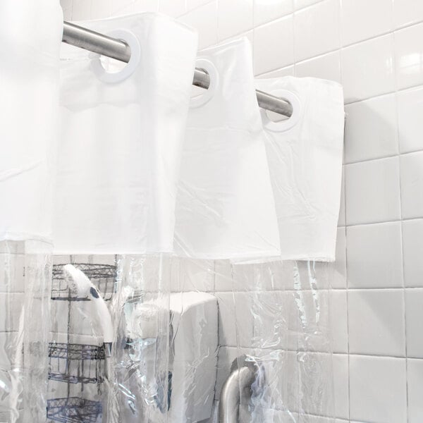 A white Hookless shower curtain with a clear vinyl window hanging in a bathroom.