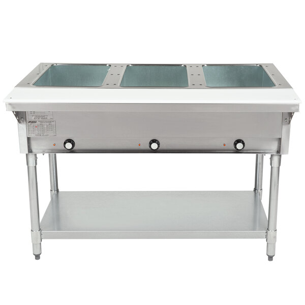 A large stainless steel Eagle Group electric hot food table with three pans inside.