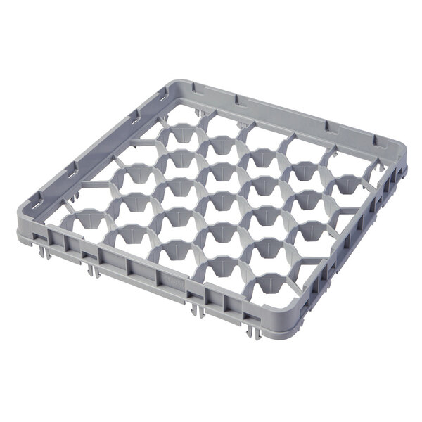 A grey plastic Cambro glass rack extender with holes.