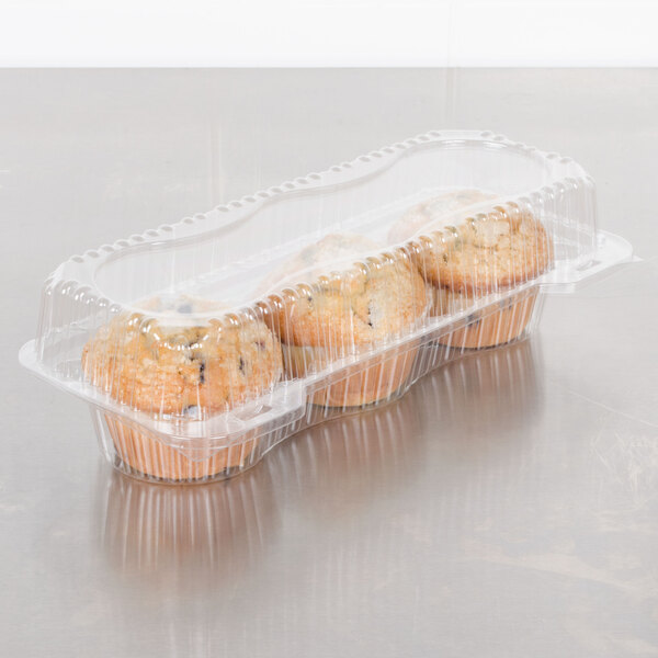 A Polar Pak clear plastic container holding three jumbo muffins.