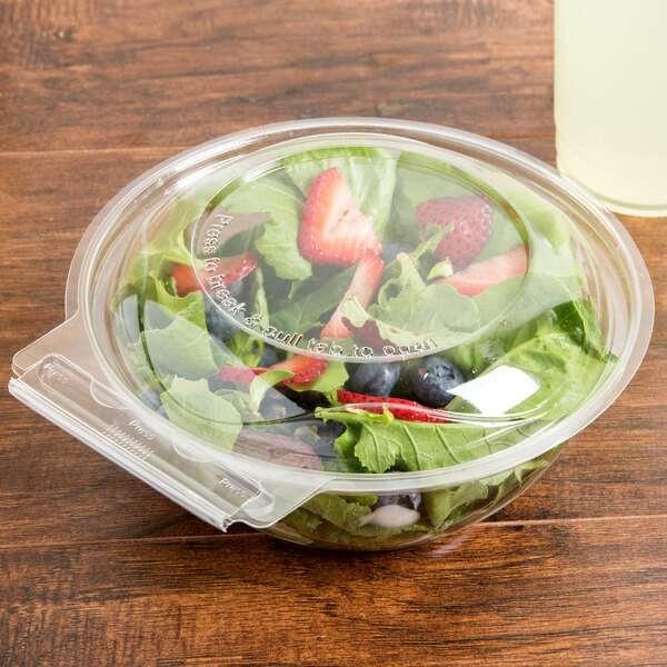 A salad in a Polar Pak clear plastic container with a lid.