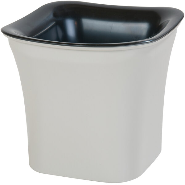 A black plastic square container with a black and white lid.