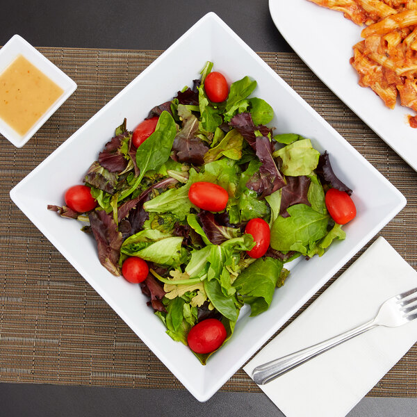 A white GET Siciliano square bowl filled with salad and pasta.