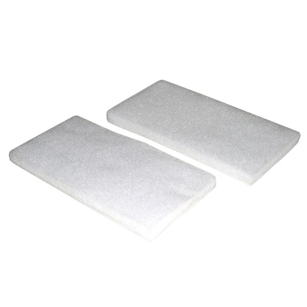 Two white rectangular foam pads.