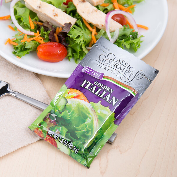 A vegetable salad with a packet of Classic Gourmet Lite Italian Dressing.