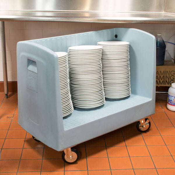 A blue Metro dish cart full of plates.