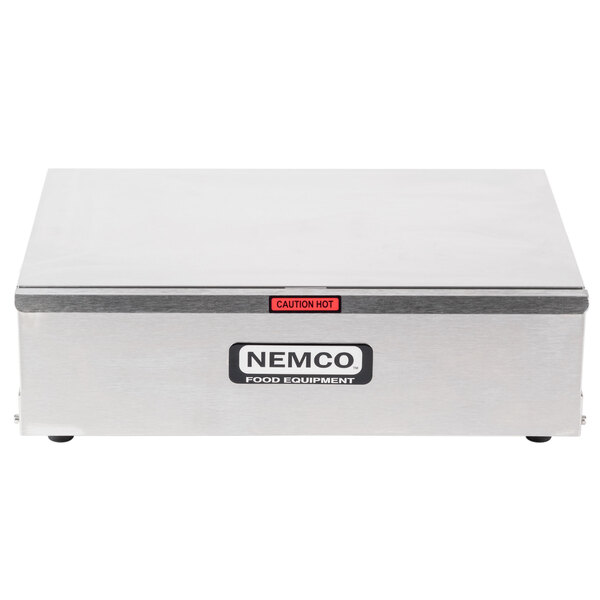 A Nemco metal hot dog bun warmer box on a counter.