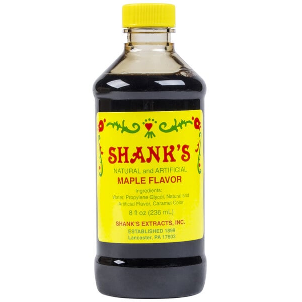 A bottle of Shank's Natural and Artificial Maple Flavor with a yellow cap.