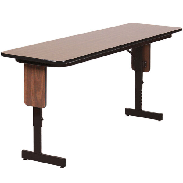 A Correll rectangular seminar table with a black frame.